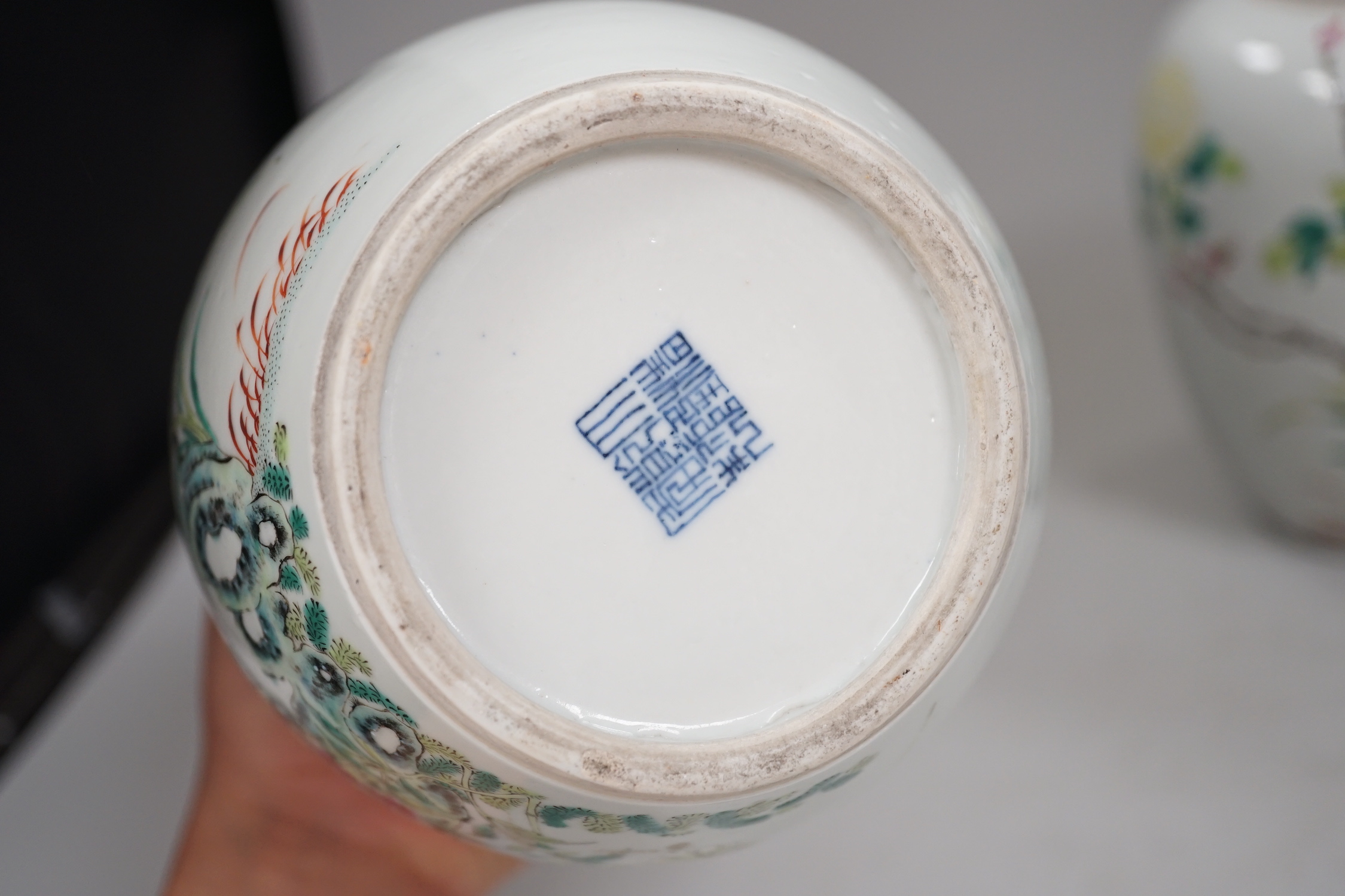 A pair of Chinese famille rose jars and covers, Qianlong seal marks, late 19th century, 20cm high